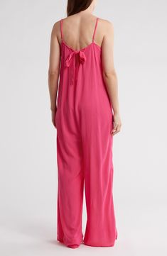 A V-neckline defines the silhouette of a wide leg jumpsuit complete with a solid hue for versatile appeal. 59" full length (size Small) V-neck Sleeveless 100% rayon Hand wash, dry flat Imported Gauze Jumpsuit, Wide Leg Jumpsuit, Bright Pink, Nordstrom Rack, Full Length, Wide Leg, Hand Wash, Jumpsuit, Nordstrom