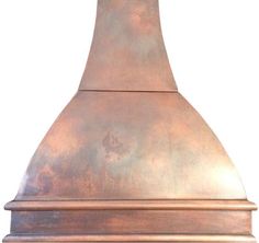 a copper colored stove hood on a white background