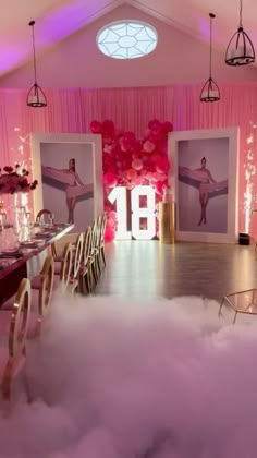 a room filled with lots of white clouds and pink walls covered in balloons, candles and pictures