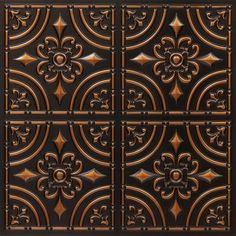 an intricately designed ceiling tile in bronze and black with fleur de lis on it