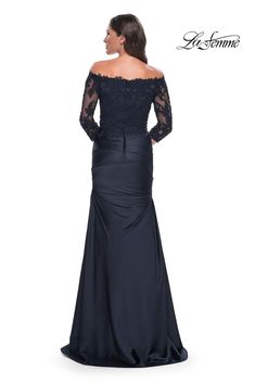 a woman wearing an off the shoulder evening gown with sleeves and lace detailing on it