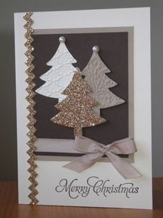 a card with three christmas trees on it