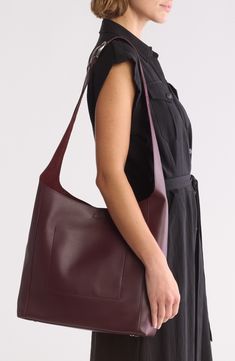 Gleaming hardware and rich leather distinguish a spacious shopper bag fitted with an adjustable strap for easy on-the-go styling. Bridge-clip closure Adjustable crossbody strap Interior wall pocket Protective metal feet Lined Leather Imported Burgundy Crossbody Bag For Work, Burgundy Crossbody Bags For Workwear, Burgundy Shoulder Bag For Work, Burgundy Satchel For Everyday Fall Use, Fall Burgundy Satchel For Everyday Use, Everyday Hobo Bag With Leather Handles In Burgundy, Modern Burgundy Bags For Work, Modern Hobo Bag With Snap Closure Crossbody, Burgundy Hobo Bag With Leather Handles For Everyday