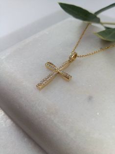 "A fine art cross in K14 made of yellow solid gold. It's decorate with lines of gold that create a very delicate cross in the middle and has small Swarovski stones throughout! A simple, minimal, inter temporal cross. Ideal for a present, engagement gift, anniversary and baptism. It is one of the most beautiful designs and can easily be worn by an adolescent or a woman of any age, who likes minimal design. The dimensions of the cross are: Height 1,26 inches (3,2 cm.) Width 0,67 inches (1,7 cm.) T Christian Thali Designs Gold, Cross Necklace Women, Locket Design, Cross Gold, Cross Christian, Gold Cross Pendant, Swarovski Stones, Gold Locket, Christian Cross