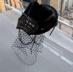 This Black Feather Bronze Studded Crystal Chain Applique Sinamay Fascinator Hat with Veil and Satin Headband is a beautiful accessory for weddings, parties, cocktail, evening, and other special occasions. It is elegant, stylish, sparkling, and super chic! The perfect Fall/Winter piece that will definitely add a fashionable touch to your outfit!! I only accept PayPal and ship all orders within 24 hours via USPS. Feel free to send me a convo with any questions. Thank you for visiting Hettie hair A Gatsby Style Evening Fascinator Headband, Vintage Headband Costume Hat For Party, Flapper Hat Headpiece For Party, Vintage Mini Hat Headband For Parties, Vintage Costume Headband For Party, Evening Gatsby Style Fascinator Headband, Gatsby Style Party Headband Hat, Flapper Party Hat Headpiece, Gatsby Style Party Fascinator