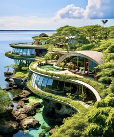 an unusual house with plants growing on the roof and windows that look like they are floating in water