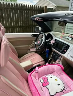 the interior of a car with hello kitty decorations