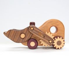 a wooden toy car with gears attached to it