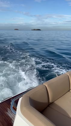 the back end of a boat traveling through the ocean