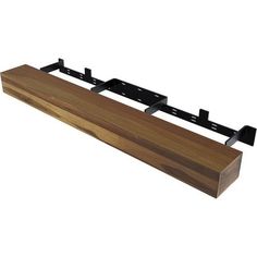 a wooden shelf with two black brackets on the top and one is attached to it