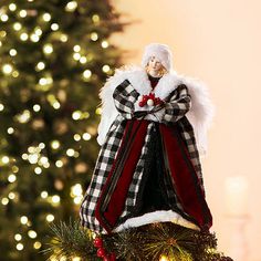 a christmas ornament hanging from the top of a tree