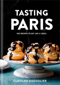 the cover of tasting paris by clotille dusouler, with pastries on