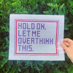 someone holding up a sign that says hold on, let me overthik this