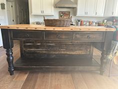 a kitchen island made out of an old wooden box with drawers on the top and bottom