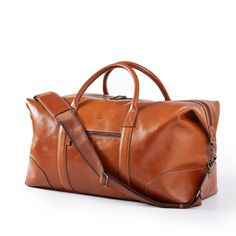 Impeccably crafted from high quality leather, the Graham Leather Collection is filled with classic styles for work and travel. Designed with a place for everything you need for a weekend away, this overnighter features both carrying handles and an adjustable shoulder strap. Add the matching hanging toiletry case for added function and fashion. A great gift for the stylish traveler, you can a classic monogram for an extra elevated touch.    Includes Graham Leather Overnighter and Graham Leather H Classic Leather-lined Luggage For Weekend Trips, Rectangular Cognac Travel Bag For Everyday Use, Cognac Rectangular Travel Bag For Everyday Use, Classic Everyday Rectangular Travel Bag, Classic Rectangular Everyday Travel Bag, Everyday Cognac Rectangular Travel Bag, Classic Rectangular Weekender Bag With Smooth Grain, Classic Travel Tote Bag With Smooth Grain, Rectangular Luggage With Leather Lining For Everyday Use