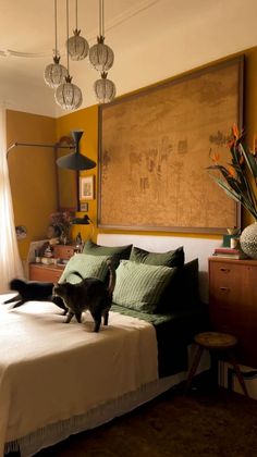 a cat standing on top of a bed in a bedroom