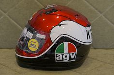 the helmet is red, white and black with an eagle on it's side