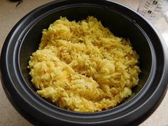 a bowl filled with rice on top of a table