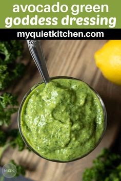 avocado green goddess dressing in a glass with a spoon