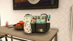 a table with some bags and oranges on it in front of a wallpapered background