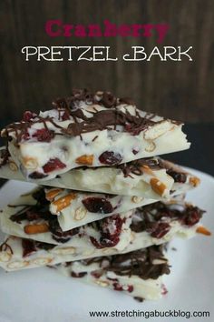 cranberry pretzel bark is stacked on top of each other with chocolate and nuts