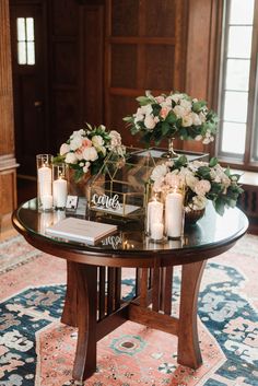 a table with candles and flowers on it