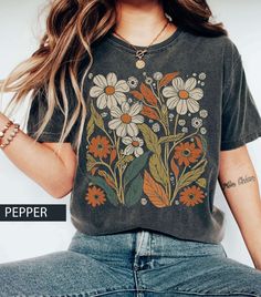 This Gender-Neutral Adult T-shirts item by LightmindDesign has 1276 favorites from Etsy shoppers. Ships from San Jose, CA. Listed on Jul 25, 2024 Cottagecore Shirt, Botanical Shirt, Look Retro, Nature Shirts, Color Ink, Flower Shirt, Boho Print, Comfort Color, Look Plus