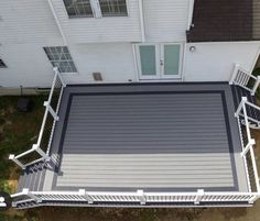 an overhead view of a deck with white railings