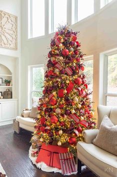 a red and gold christmas tree in a living room