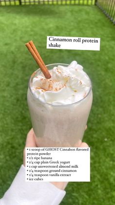 a person holding up a drink with cinnamon in it and information about how to make the drink