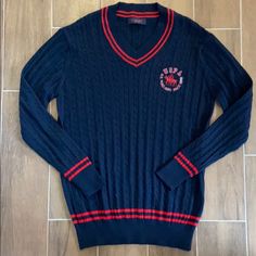 Navy And Red Polo Sweater. Never Worn, Like New. Cotton V-neck Sweater For College, Preppy Long Sleeve Tops With Ribbed Cuffs, Navy Winter College Tops, Navy Winter College Top, Navy Winter Top For College, Navy Winter Tops For College, Preppy Cotton V-neck Sweater, Winter Preppy Tops With Ribbed Cuffs, Navy Cable Knit Crew Neck Top