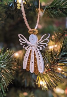 an ornament is hanging from a christmas tree