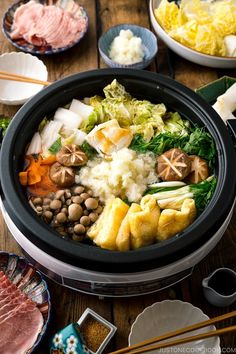 With napa cabbage, fried tofu, mushrooms, and mochi simmered in kombu dashi, Mizore Nabe is a Japanese hot pot cooked with grated daikon. The white radish resembles the winter sleet (mizore in Japanese) of which the hot pot gets its name. A perfect meal to warm up in the winter! #mizorenabe #hot pot | Easy Japanese Recipes at JustOneCookbook Pickled Daikon Recipe, Kombu Dashi, Cabbage Fried, Daikon Recipe, Japanese Hot Pot, Slow Cooker Chicken Wings, White Radish, Deep Fried Tofu, Just One Cookbook