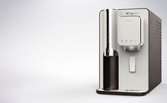 an automatic coffee maker is shown on a white background with no one around it to see