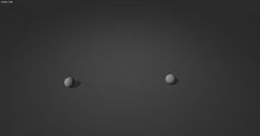 three white balls in the middle of a black background