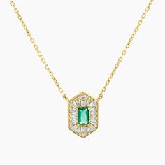 Elevate your style with our Gold-Plated over Sterling silver Art Deco Pendant. Meticulously crafted, this captivating pendant showcases an emerald-cut green spinel at its center, complemented by exquisite baguettes. The unique exagonal shape adds a touch of vintage elegance. With a 16-inch chain and 2-inch extension, this pendant offers a customizable fit. Embrace the vintage-inspired beauty of this Gold-Plated Art Deco Pendant, perfect for adding a touch of sophistication and glamour to any ensemble. Green Emerald Baguette Cut Necklace, Elegant Green Baguette Cut Necklace, Elegant Green Baguette Cut Emerald Necklace, Elegant Green Baguette-cut Emerald Necklace, Emerald Cut Baguette Diamonds May Birthstone Jewelry, Emerald Cut Baguette Diamond Jewelry For May Birthstone, Silver Emerald Jewelry With Baguette Diamonds, Green Baguette-cut Art Deco Jewelry, Green Gemstone Baguette Cut Necklace