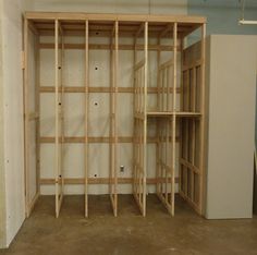 an empty room with unfinished shelves in it