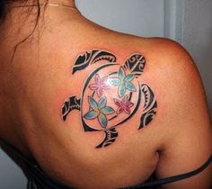 a woman with a turtle tattoo on her back