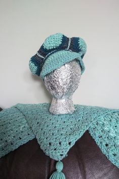 "Show off your retro style with this crocheted patchwork cap in fun teal and turquoise color combo! This brimmed tam is hand crocheted with a stretchy stitch and is roomy for short or long hair. The hat accomodates 21\" up to 24\" around. Hand washable. KraftyChickStudio is offering free domestic shipping on this item anywhere in the USA" Blue Bohemian Yarn Hat, Blue Bohemian Crochet Hat, Bohemian Blue Hand-knitted Crochet Hat, One Size Blue Bohemian Crochet Hat, Blue Crochet Hat One Size Fits Most, Blue Bohemian Crochet Hat With Brim, Blue Brimmed Bohemian Crochet Hat, Blue Handmade Crochet Hat One Size, Blue Hand-knitted Crochet Hat One Size