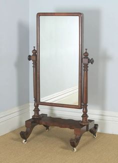 a mirror sitting on top of a wooden stand