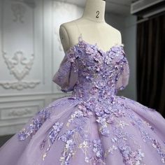 Welcome to Couture Candy's exclusive collection of purple Quinceañera gowns for the 2024 season. Our selection of dresses is expertly made to make every young woman feel exceptional on her milestone day. Our selection includes everything, whether you're searching for something traditional with intricate needlework or something more contemporary with streamlined, clean lines. Blue Pink And Purple Quince Dress, Purple 16 Dresses, Purple Quinceanera Dresses With Flowers, Qinsenara Dresses Purple, Purple Blue Quinceanera Dresses, Qencenera Dresses Purple, Debut Gowns 18th Elegant Purple, Quncie Dresses Lavender, Purple Dress Quince