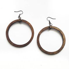 Classic Wooden Hoop Earrings  These simple wooden earrings are a classic hoop shape that never go out of style. They are made out of stained birch wood and work with nearly every outfit.  Very light weight and easy to wear. Laser cut jewelry with a minimal earring design.  There are four Brown Hoop Single Earring, Brown Single Hoop Earring, Brown Hoop Earrings For Gift, Brown Hoop Earrings With Ear Wire, Laser Cut Necklace, Wood Hoop Earrings, Laser Cut Wood Earrings, Earrings Circle, Laser Cut Jewelry