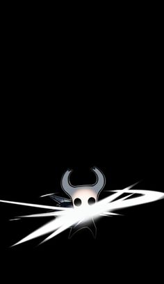 a bull with horns on it's head is in the middle of a black background