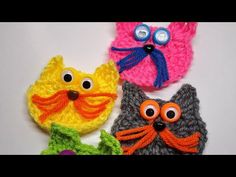 three crocheted cats and one cat with big eyes