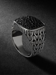 John Hardy's signet ring is designed to look like its signature chain-weaving technique. It's handcrafted from silver and set with scores of black sapphires along the bezel. Black Sapphire Fine Jewelry Ring, Formal Black Spinel Ring In Fine Jewelry Style, Formal Fine Jewelry Black Spinel Ring, Black Spinel Rings For Formal Occasions, Luxury Black Spinel Round Ring, Black Sapphire Ring In Luxury Style, Black Sapphire Luxury Ring, Black Sapphire Ring For Formal Occasions, Black Sapphire Ring With Gemstone In Luxury Style