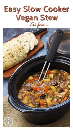 an easy slow cooker vegan stew recipe in a crock pot with bread on the side