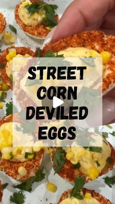 corn deviled eggs are topped with cheese and garnished with fresh herbs for an easy appetizer