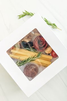 a white box filled with different types of food