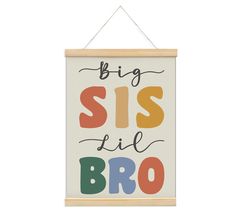 a sign that says, big sis little broo on it hanging from a wooden frame