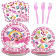 a pink tableware set with candy and candies on the plate, napkins and fork